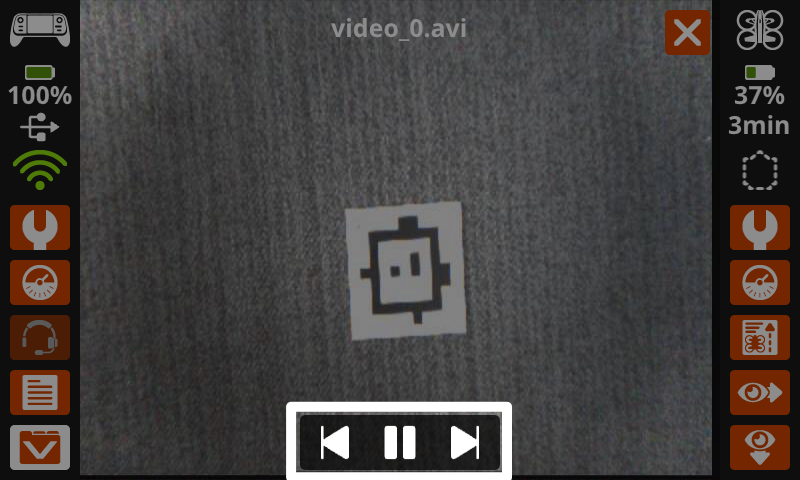 The controller screen shows a recorded video in the display, and reads video_0.avi at the top and the controls for forward, pause, and backward are highlighted on the bottom of the screen.