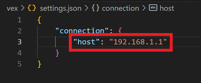 Se abre un archivo settings.json en un editor de código, que muestra una línea resaltada donde la dirección IP del host está configurada en 192.165.5.1 dentro de un objeto JSON bajo la clave de conexión.