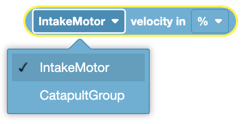 The image shows a block that retrieves the velocity of the "IntakeMotor" in percent (%). The block is light blue and rounded, indicating its use for reporting a value. A dropdown menu is visible, showing "IntakeMotor" as the selected option, with "CatapultGroup" as an alternative option, allowing the user to choose which motor's velocity to retrieve.