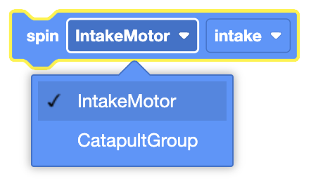 The image shows a block labeled "spin," with an option selected for "IntakeMotor" and another option below labeled "CatapultGroup." The "IntakeMotor" is chosen, and this selection likely relates to configuring which motor or group of motors will perform the spinning action in the "intake" direction. The dropdown menu allows for selecting different motors or motor groups for this operation.