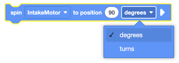 The image shows a coding block configured to spin the "IntakeMotor" to a specific position of 90 units. A dropdown menu is open, allowing the user to select between "degrees" and "turns" as the unit of measurement for the motor's position. The current selection is "degrees."