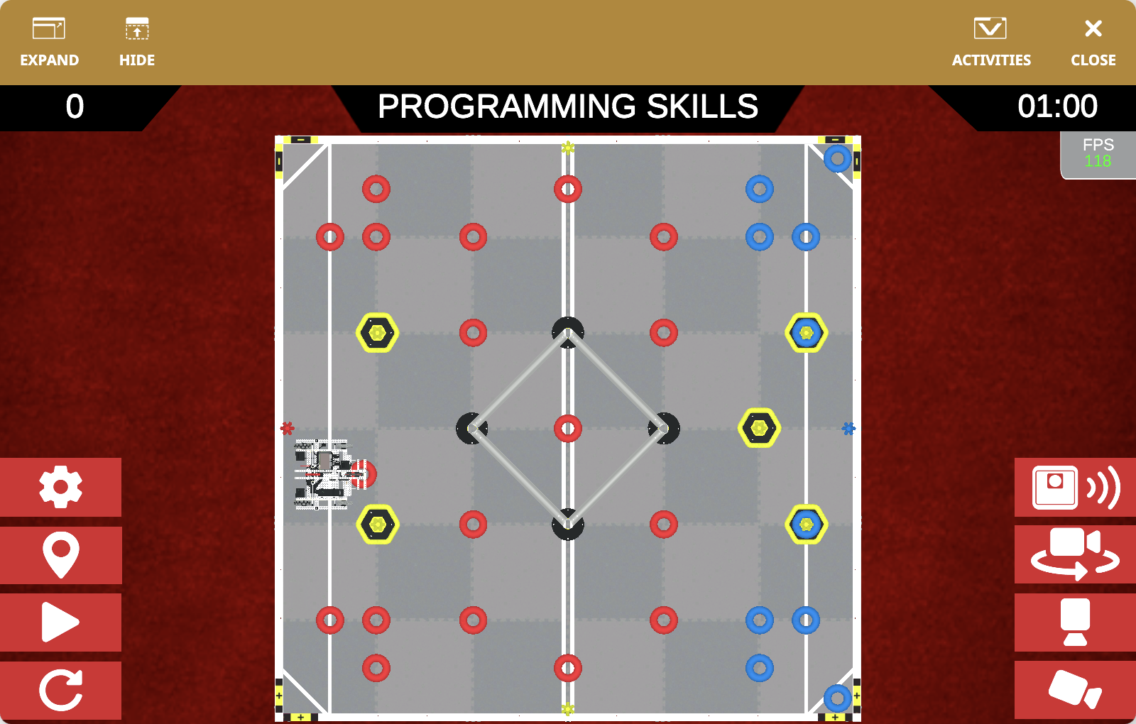 The VEXcode VR Playground window showing the V5RC 24-25 High Stakes Playground. It shows the Axel Robot scoring Rings and Mobile Goals in the V5RC 24-25 Virtual Skills field.